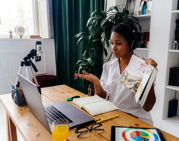 A tutor teaching a live online lesson from home